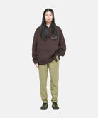 Gramicci Loose Tapered Ridge Pant Faded Olive with a relaxed tapered fit, eco cotton twill and integrated belt for everyday wear.