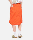 Full-body view of model wearing Gramicci Nylon Packable Midi Skirt Navy with a lightweight recycled nylon design, adjustable waist and packable construction for everyday comfort.