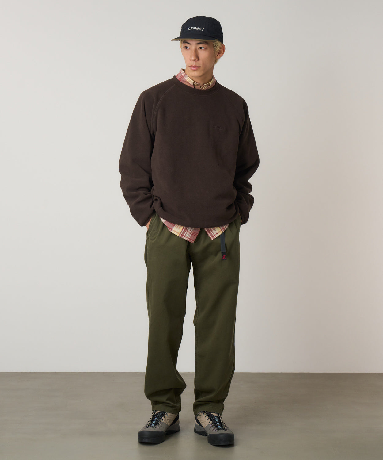 Model wearing Gramicci Pant Pine relaxed fit cotton twill utility pants with cinch belt by LE.SHOP