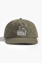 Olive green cotton cap front detail view with Home Comforts design
