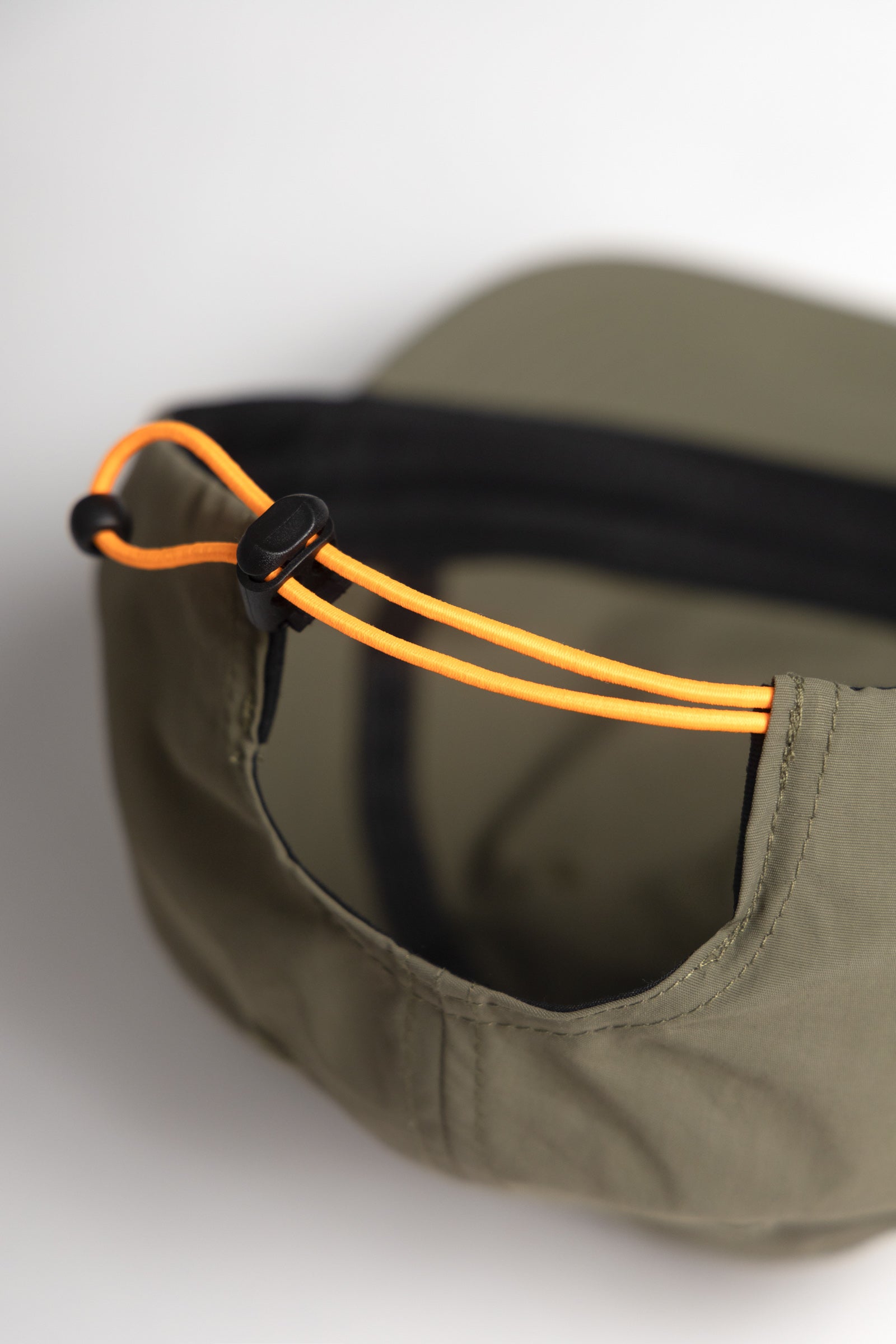 Olive green cotton cap back view with adjustable strap for everyday comfort