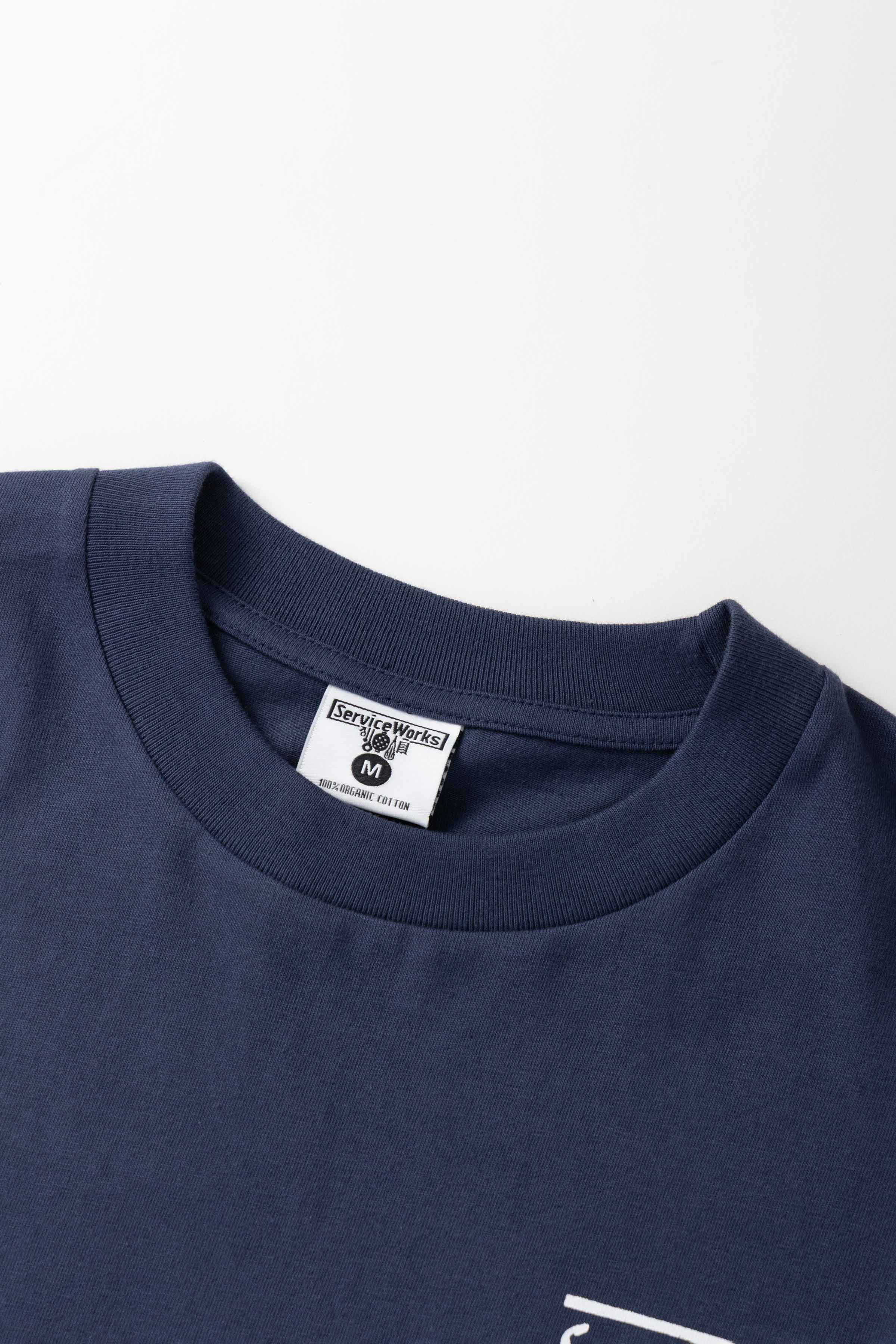 Detail view of navy Milos Tee highlighting organic cotton fabric, midweight texture and high-quality everyday streetwear construction