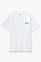 Front view of model wearing white Milos Tee featuring organic cotton fabric, standard fit and clean everyday streetwear style