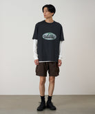 Model wearing Nylon Explorer Cargo Shorts in Chocolate