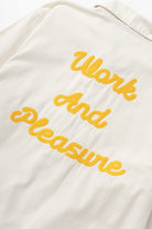 Detail of off white twill work jacket pocket design for men, durable utility workwear styling