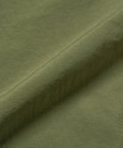Olive nylon paneled trek pants with wide-leg relaxed fit and durable lightweight fabric, front product view for everyday and streetwear style