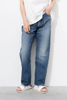 Ordinary Fits relaxed fit Type Loose jeans styled with white shirt in studio setting