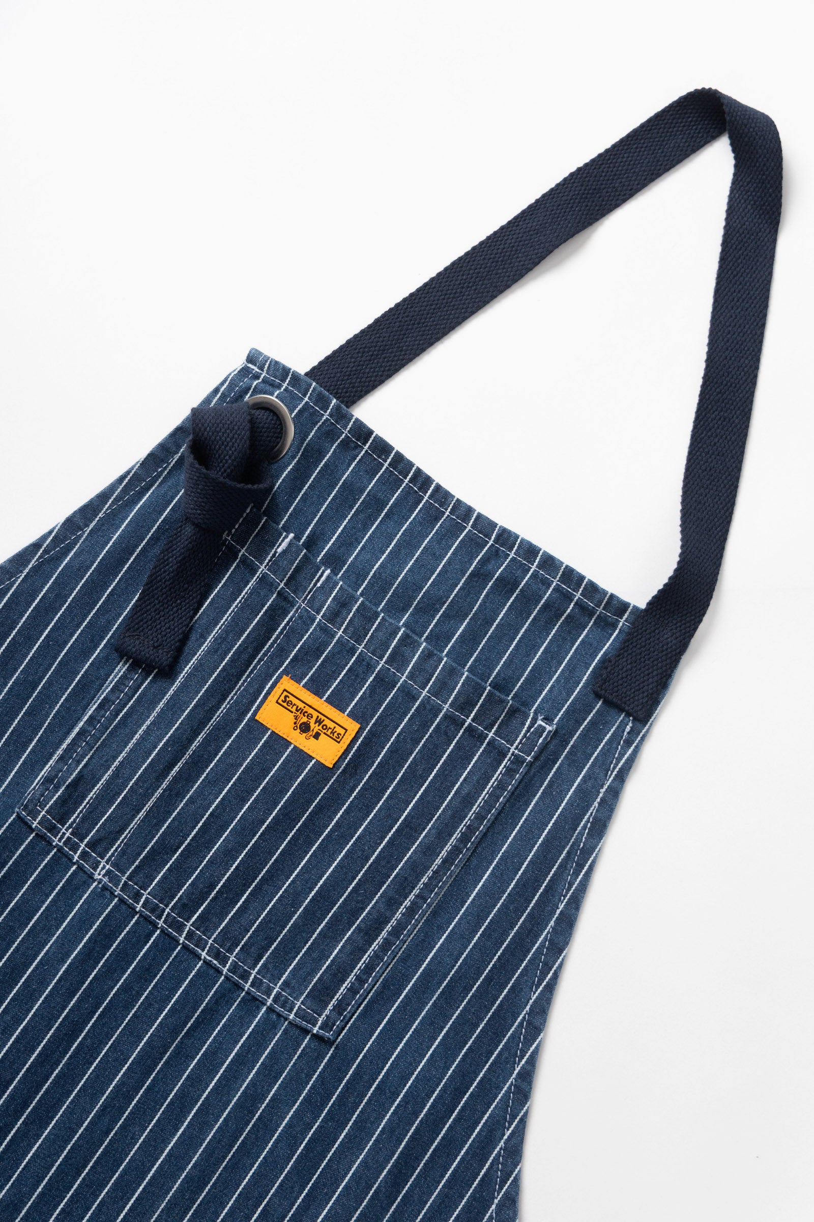 Indigo pinstripe denim apron back view adjustable straps premium workwear cooking barista workshop