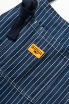 Indigo pinstripe denim apron lifestyle view premium workwear for cooking barista and workshop use