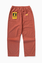 Model wearing clay Polka Dot Chef Pants in relaxed fit, featuring organic cotton fabric and versatile workwear-inspired streetwear styling