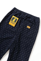 Detail view of navy Polka Dot Chef Pants highlighting organic cotton fabric, reinforced stitching and functional workwear pocket design