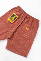 Detail view of clay chef shorts highlighting organic cotton fabric, reinforced stitching and functional utility pocket design for everyday wear
