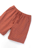Front view of model wearing clay chef shorts with organic cotton fabric, relaxed silhouette and functional utility pockets for casual and streetwear use