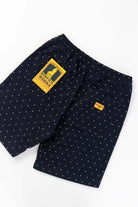Detail view of navy Polka Dot Chef Shorts highlighting organic cotton fabric, reinforced stitching and functional workwear pocket design