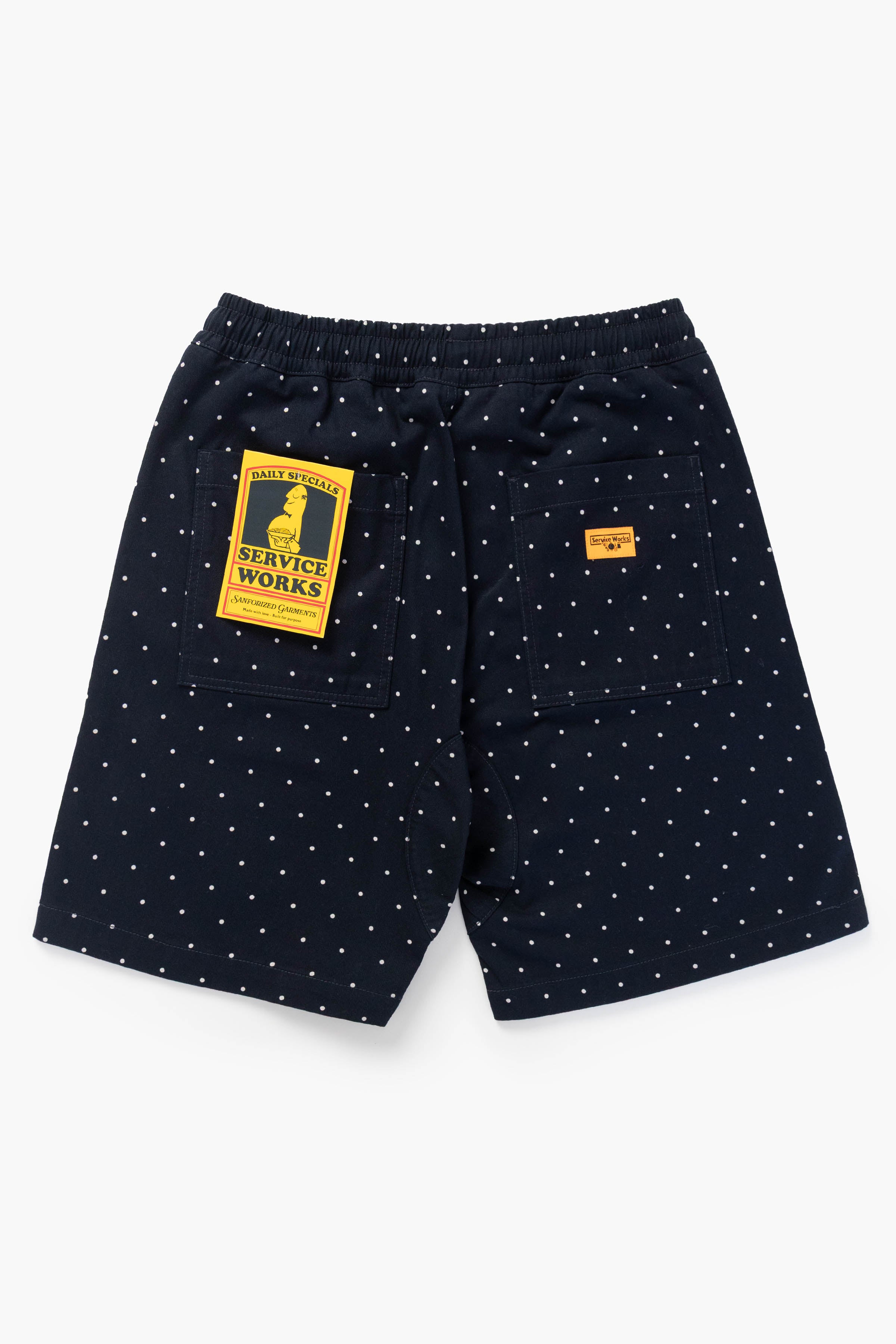 Model wearing navy Polka Dot Chef Shorts shown from back featuring organic cotton fabric, relaxed silhouette and durable workwear construction
