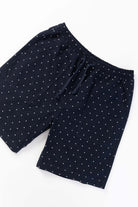 Front view of model wearing navy Polka Dot Chef Shorts featuring organic cotton fabric, relaxed silhouette and functional workwear styling