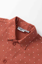 Model wearing clay Polka Dot Chore Shirt shown from back, featuring organic cotton fabric, clean silhouette and classic workwear styling