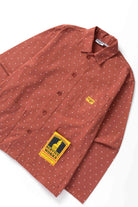 Front view of model wearing clay Polka Dot Chore Shirt featuring organic cotton fabric, utility pockets and timeless workwear styling