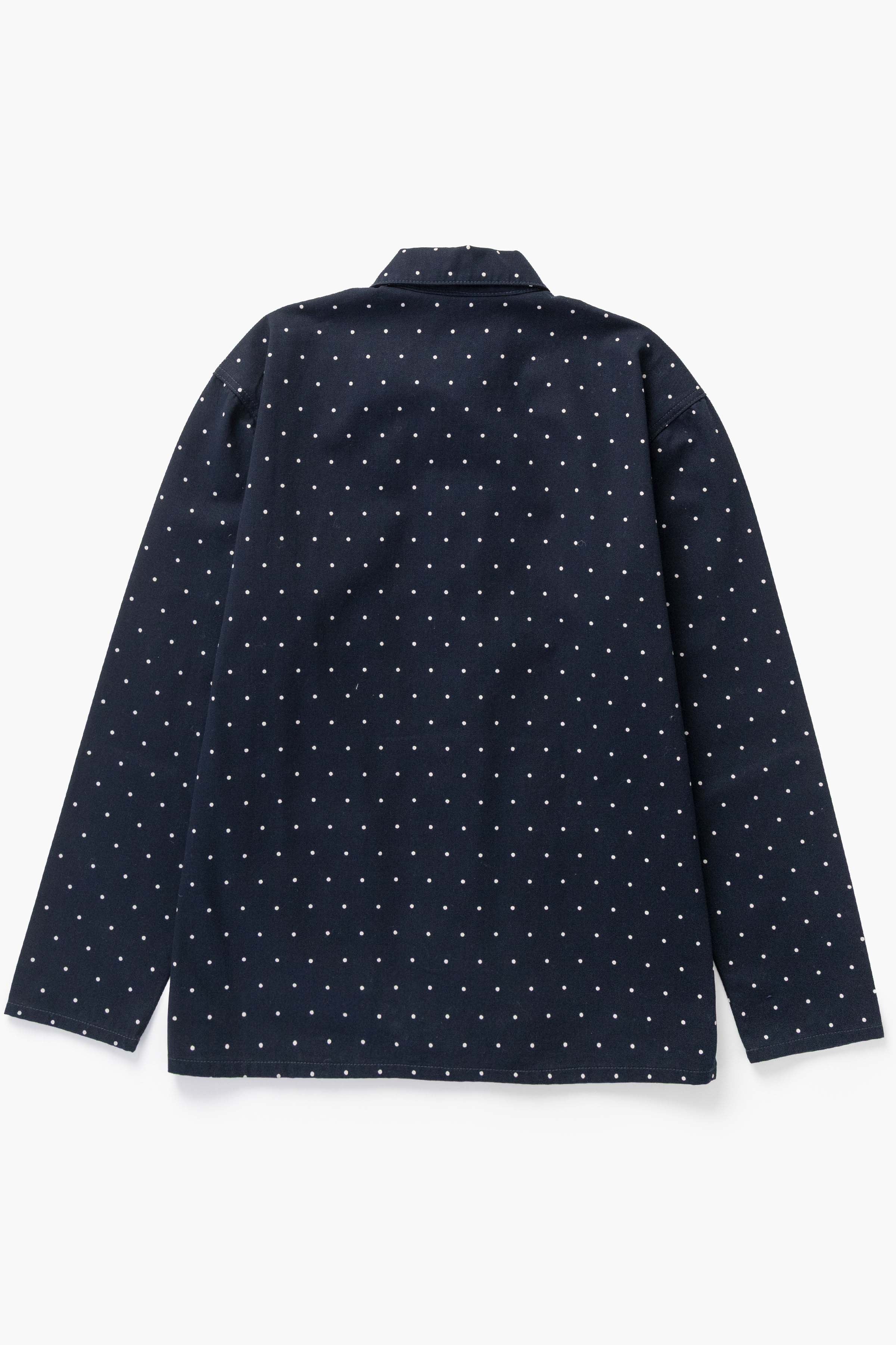 Close lifestyle view of Polka Dot Chore Shirt in navy made from GOTS organic cotton drill, showing relaxed fit, fabric texture and workwear styling
