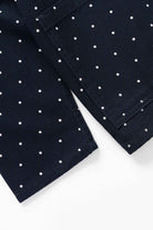 Model wearing Polka Dot Chore Shirt in navy styled for everyday workwear, made from GOTS organic cotton drill with relaxed fit and utility design