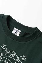 Model wearing forest Pots & Pans Tee shown from back featuring organic cotton fabric, clean silhouette and relaxed streetwear fit