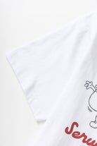Model wearing white Pots & Pans graphic t-shirt shown from back, featuring organic cotton fabric, clean standard fit and everyday streetwear styling