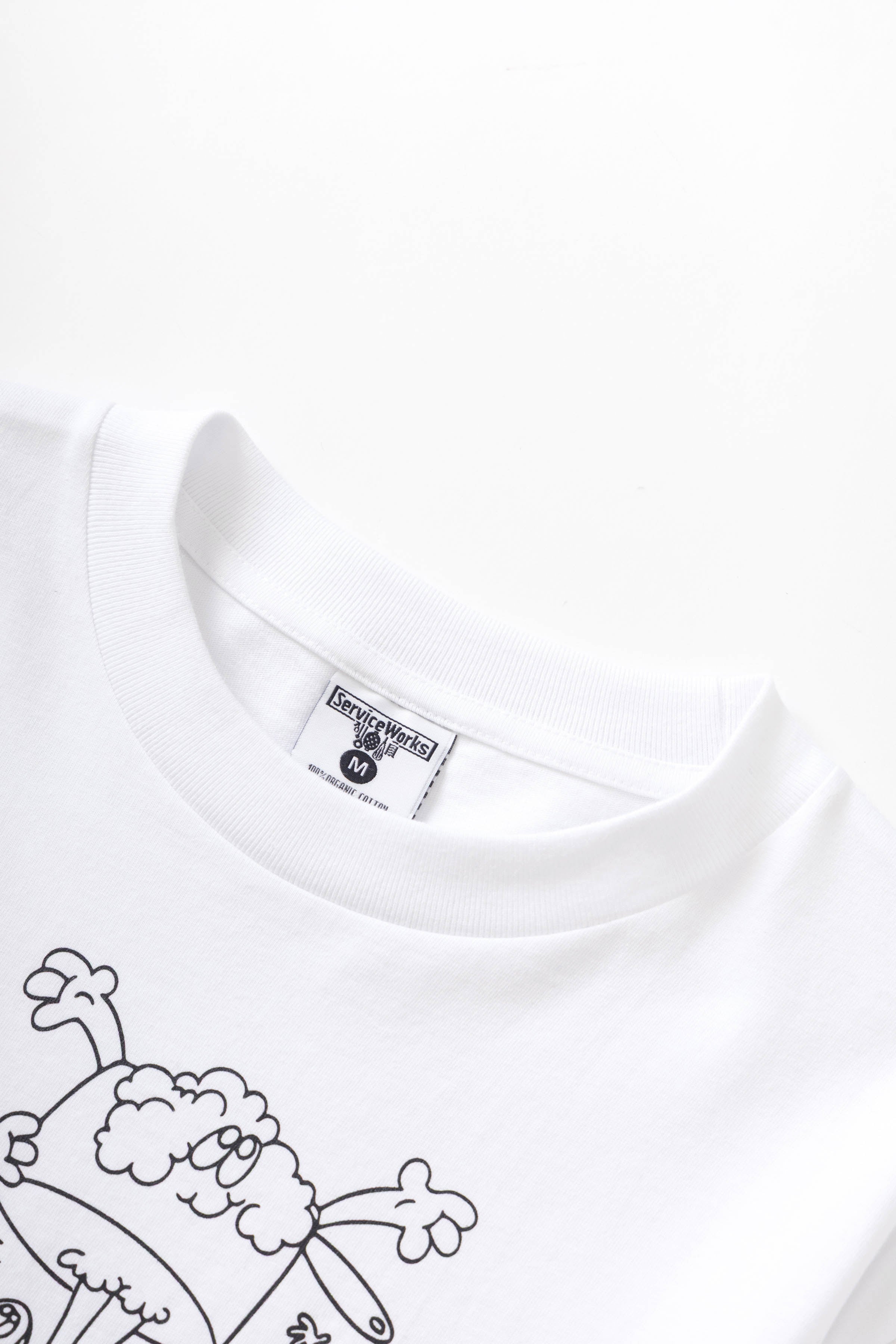 Side view of model wearing Pots & Pans Tee in white made from 250 GSM GOTS organic cotton with standard fit and midweight fabric