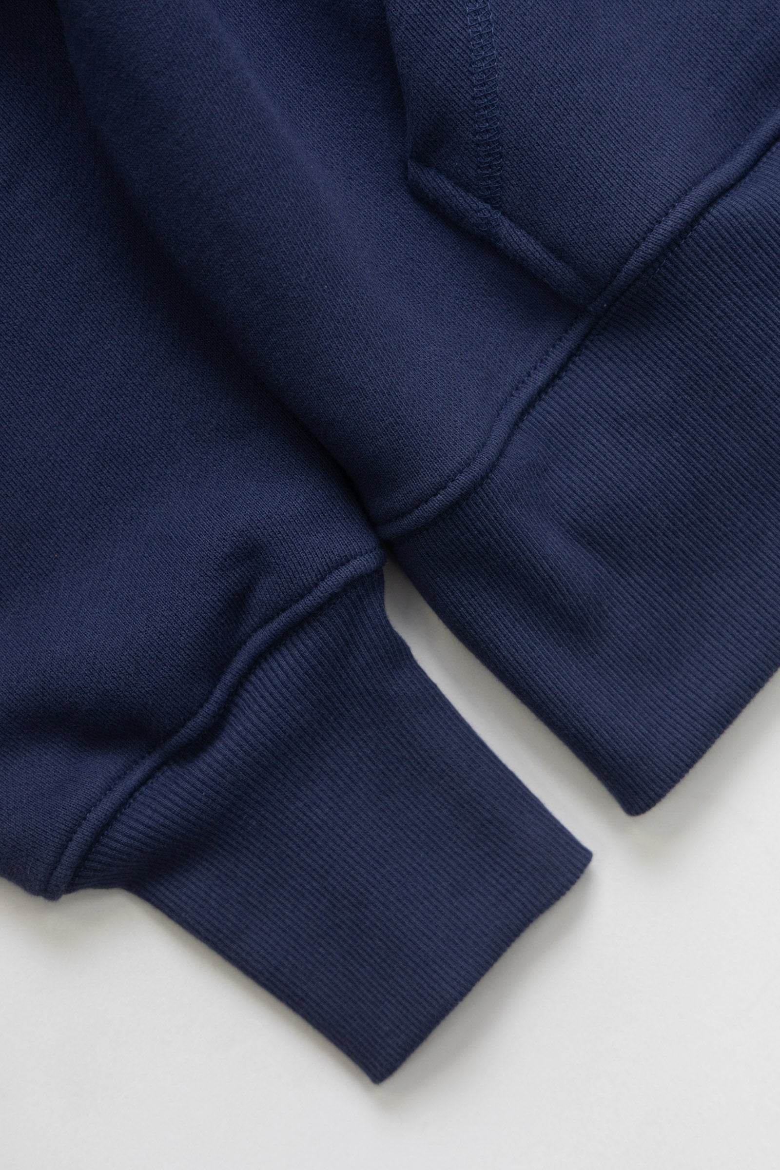 LE.SHOP Radish Hoodie Navy streetwear hoodie angled side view in navy