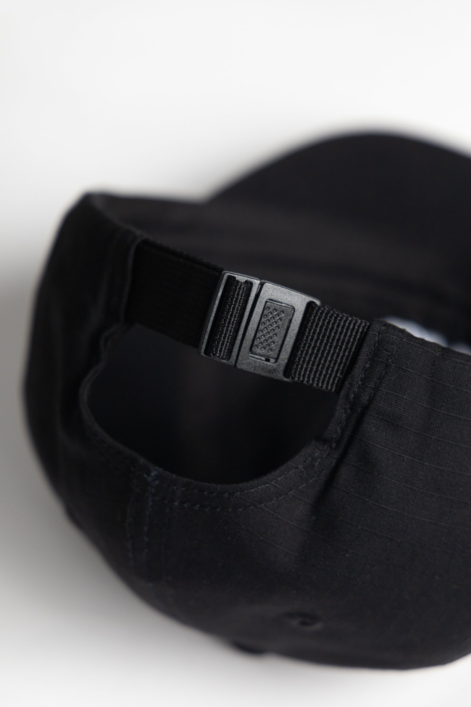Back view of Ripstop Service Cap in black made from durable cotton ripstop fabric with structured fit and curved brim