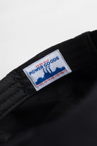 Detail view of Ripstop Service Cap in black made from durable cotton ripstop fabric with structured fit and curved brim