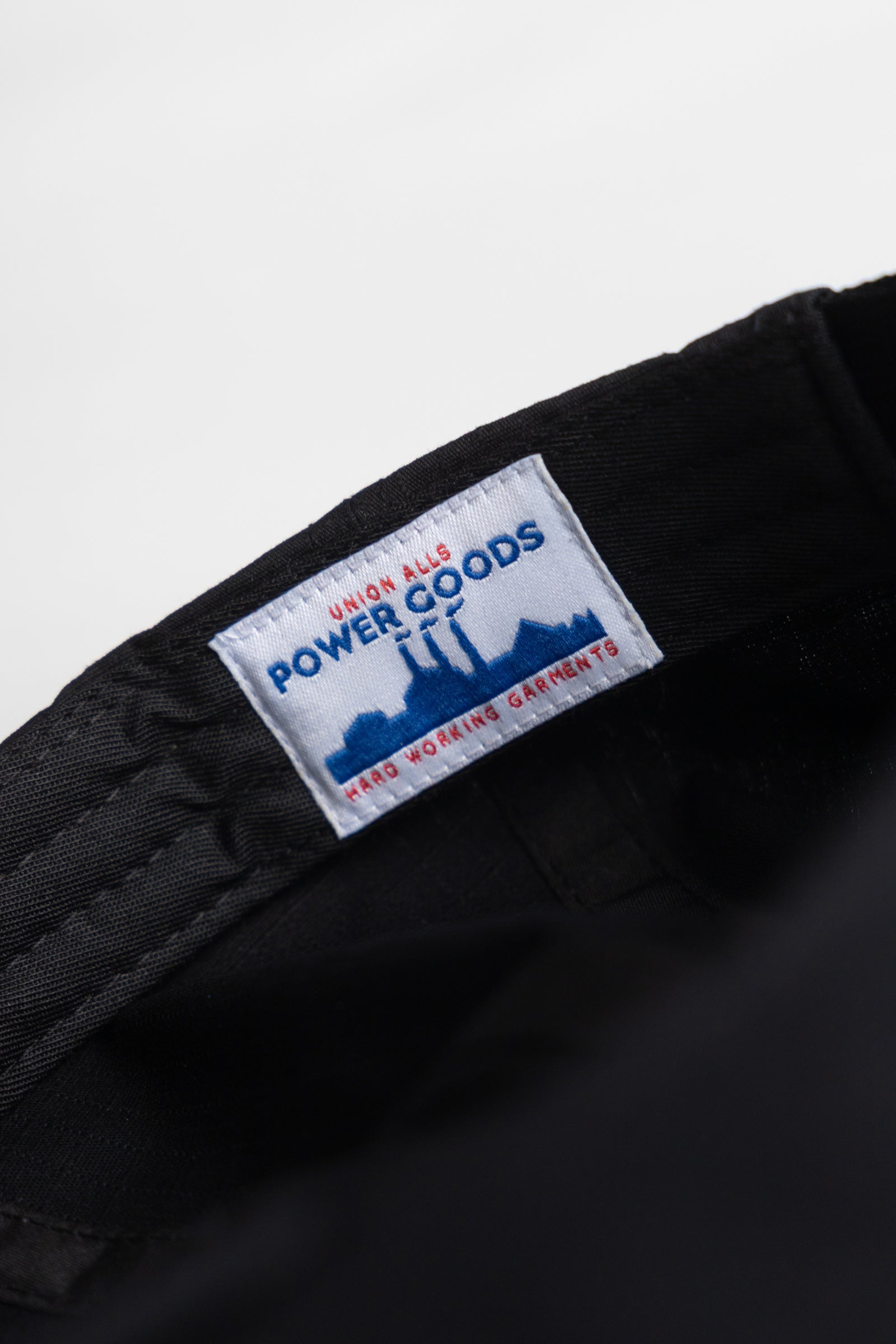 Detail view of Ripstop Service Cap in black made from durable cotton ripstop fabric with structured fit and curved brim