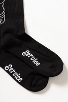 Black Salt + Pepper crew socks by Service Works, graphic detail and side view