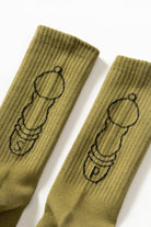 Olive Salt + Pepper crew socks by Service Works with signature graphic, detailed view on white background