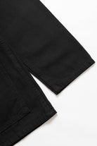 Back view of the Service Works Canvas Chore Shirt in Black featuring clean workwear design and structured canvas build.