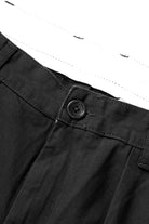 Close-up detail of the Service Works Drill Part Timer Pant in Black showing cotton drill fabric and double pleat construction.