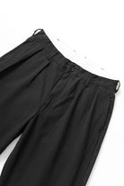 Side view of the Service Works Drill Part Timer Pant in Black showing balloon fit silhouette and relaxed drape.