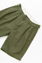 Service Works Drill Part Timer shorts in olive flat lay showing pleated workwear design front view