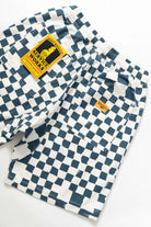 Close-up detail of the Service Works Printed Chef Short in Teal Checker showing fabric texture and reinforced stitching.