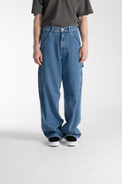 Model wearing Stan Ray Big Job Painter Pants in Single Stone with oversized relaxed fit and utility pockets