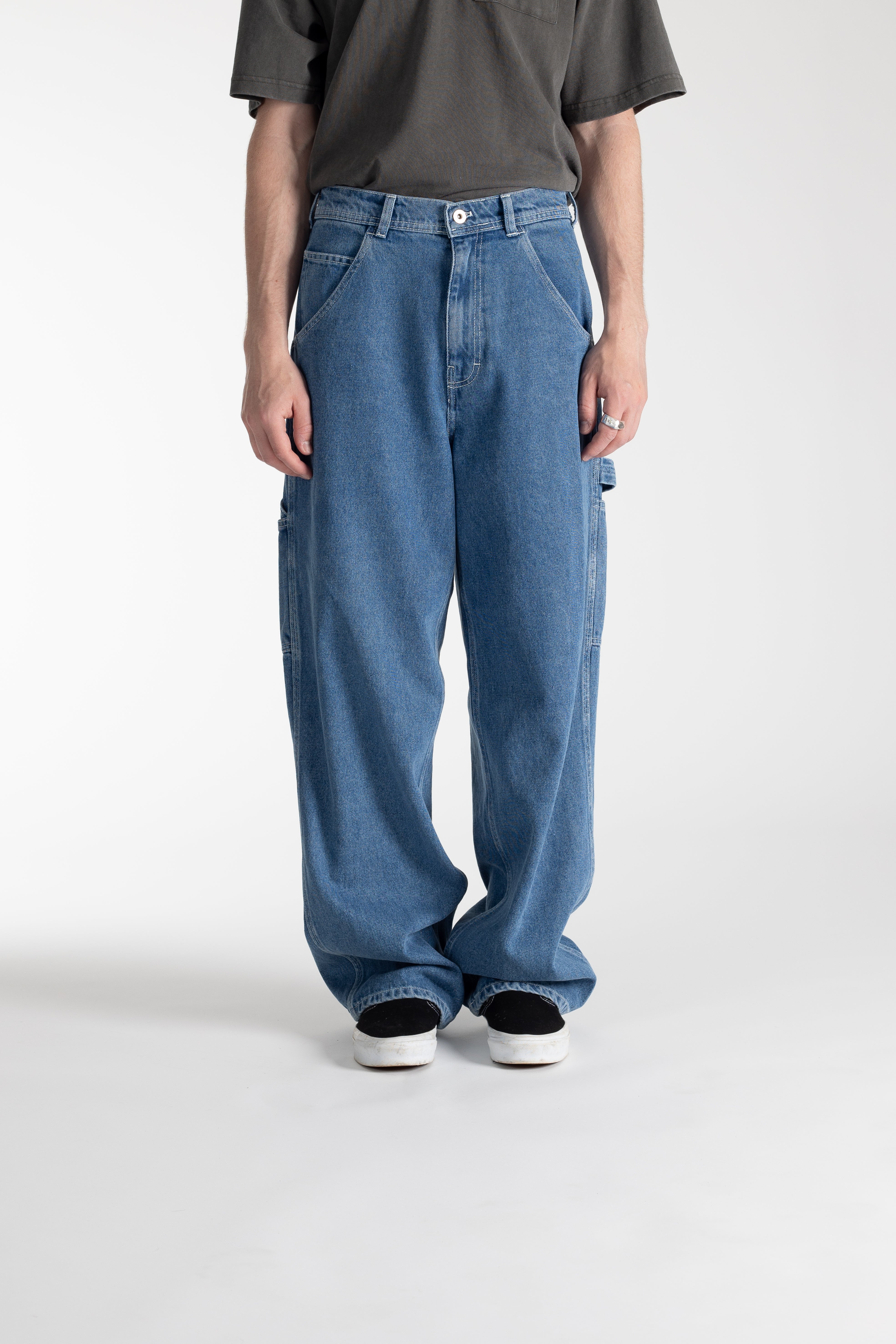 Model wearing Stan Ray Big Job Painter Pants in Single Stone with oversized relaxed fit and utility pockets