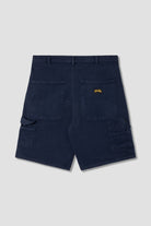Back view of model wearing Stan Ray Big Job Short Navy Duck oversized painter shorts with utility pockets and relaxed everyday fit.