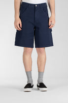 Front view of model wearing Stan Ray Big Job Short Navy Duck oversized painter shorts with durable cotton twill and relaxed fit.