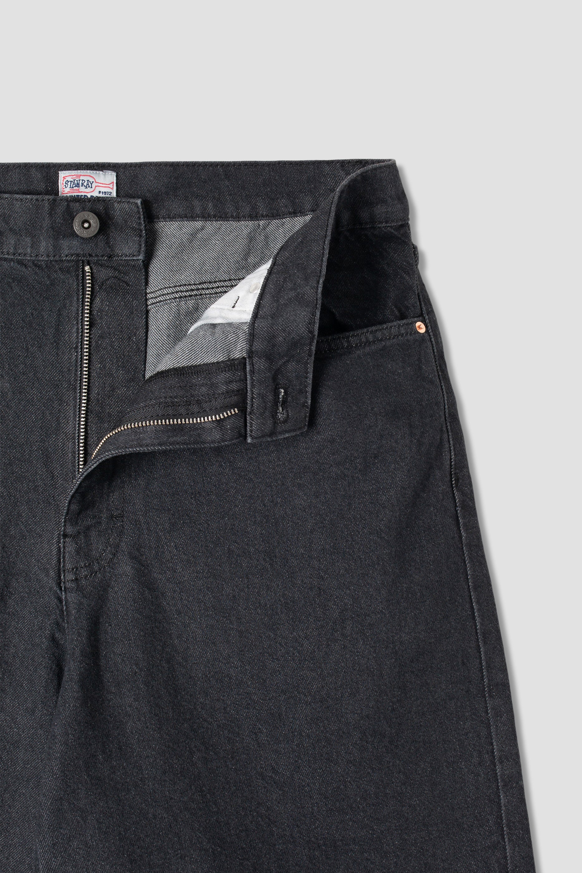 Back view of model wearing Stan Ray Wide 5 Short Charcoal Denim made from heavyweight cotton denim with relaxed fit and classic pocket detailing.
