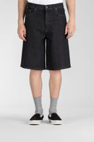 Front view of model wearing Stan Ray Wide 5 Short Charcoal Denim made from heavyweight cotton denim with a relaxed wide fit.