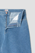 Back view of model wearing Stan Ray Wide 5 Short Mid Stone Denim made from heavyweight cotton denim with relaxed loose fit and classic pockets.