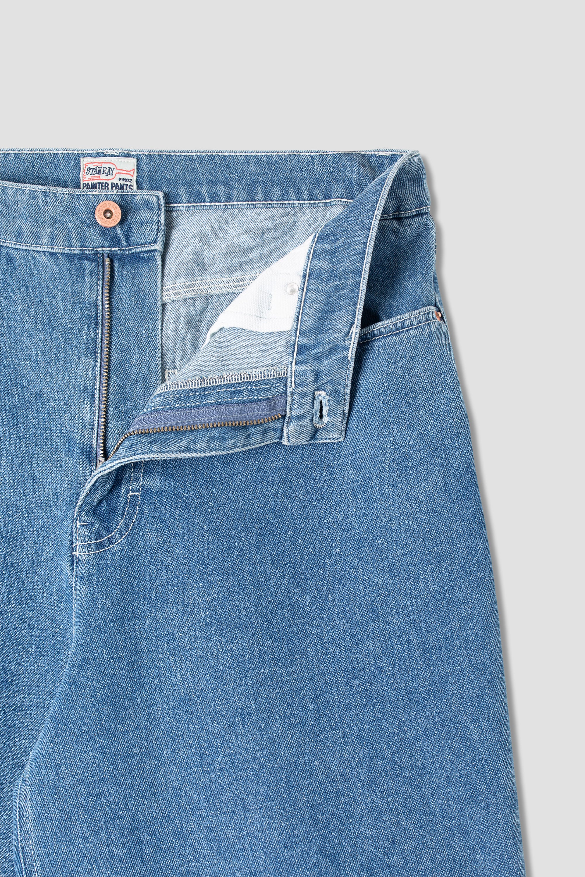 Back view of model wearing Stan Ray Wide 5 Short Mid Stone Denim made from heavyweight cotton denim with relaxed loose fit and classic pockets.