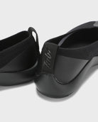 Close-up back view of black Tabi Ballerina shoes showing heel and knit upper detail