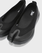Close-up front view of black Tabi Ballerina shoes highlighting the signature split toe design