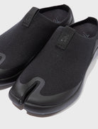 Front close-up of Tabi Mules Black split-toe knit mule shoes with soft tencel upper and cushioned Ortholite insole for comfort.