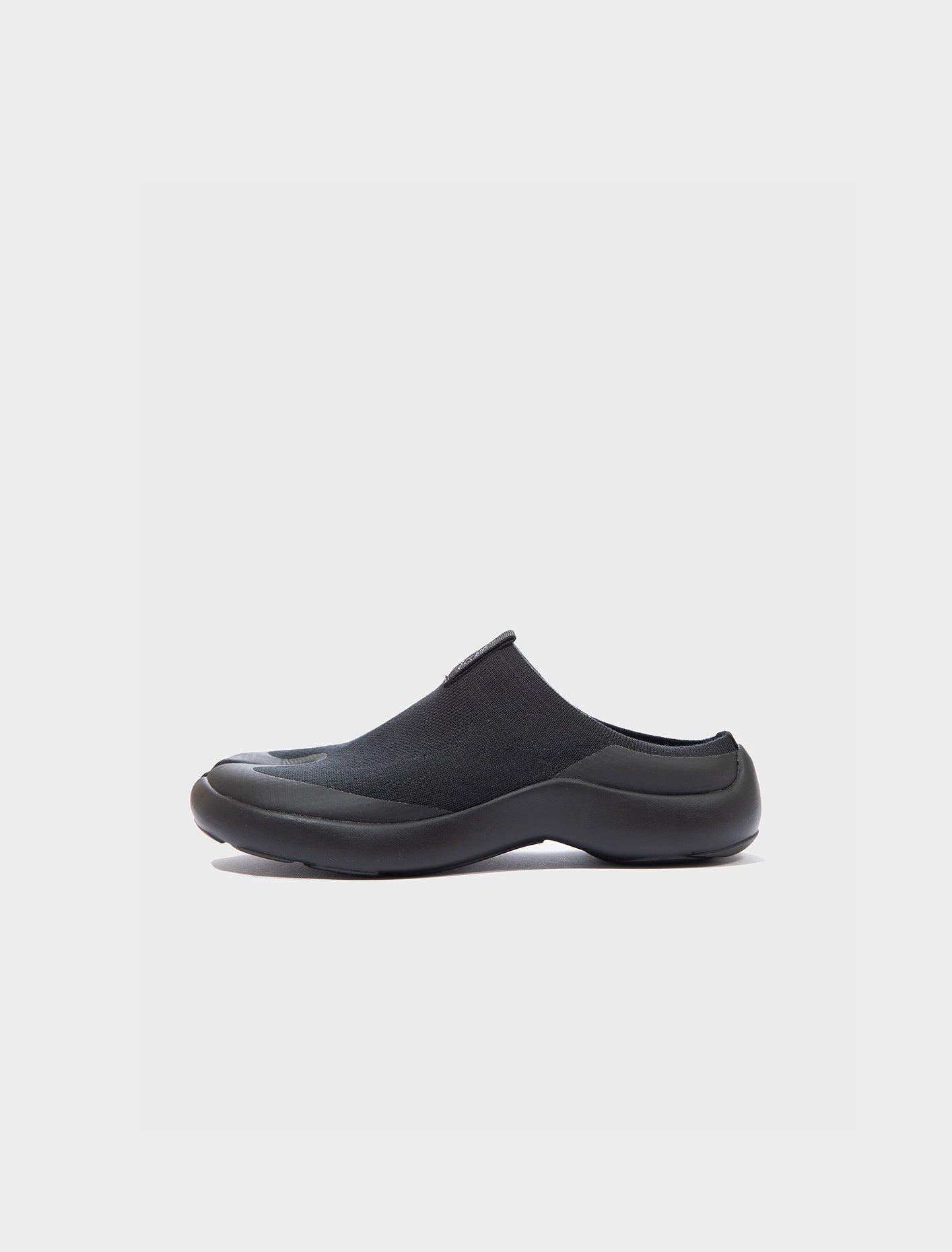 Side view of Tabi Mules Black split-toe knit mule shoes with lightweight tencel upper and cushioned Ortholite insole.